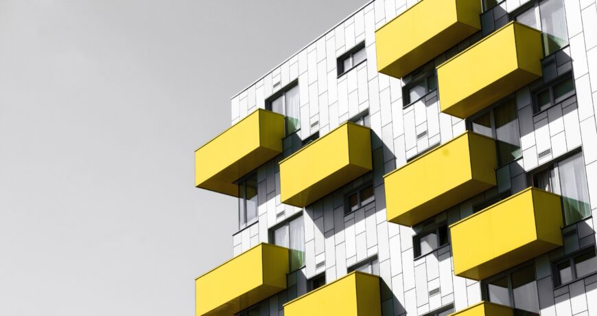 Modern apartments Modern apartments with balconies set against a blue sky